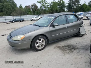 2002 Ford Taurus SES Standard z VIN 1FAFP55U42A184084, wystawiony jako Copart lot #59822495 z przebiegiem 124 835 mil mil oraz Szkoda całkowita • Salvage title. Historia ofert i sprzedaży dostępna na DreamBid. Obrazek 1.