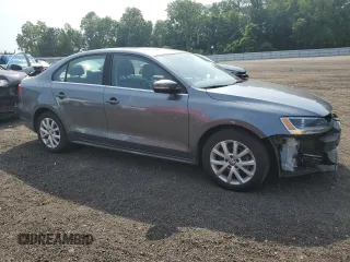 2014 Volkswagen Jetta SE z VIN 3VWD17AJ8EM405443, wystawiony jako Copart lot #59843445 z przebiegiem 156 331 mil mil oraz Szkoda całkowita • Salvage title. Historia ofert i sprzedaży dostępna na DreamBid. Obrazek 4.