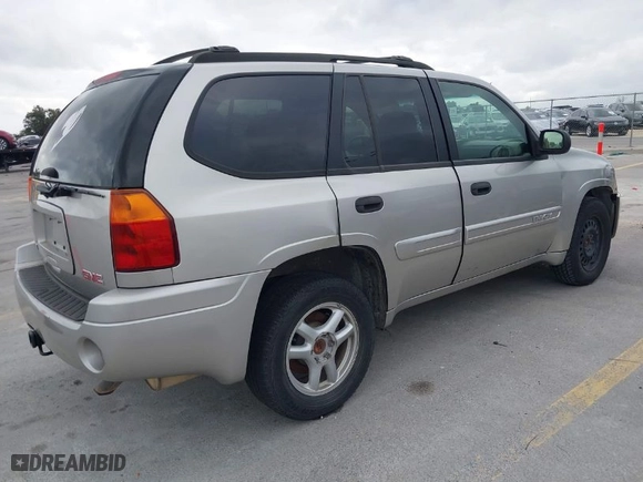 2004 GMC Envoy SLE with VIN 1GKDS13S642247715, listed as a IAAI auction lot 41472984 with 240,550 mi miles. Bid and sale history available at carsss.com. Image 4.