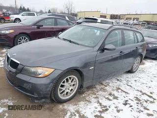 2007 BMW 3 Series 328i with VIN WBAVS13587FX15951, listed as a IAAI auction lot 41530164 with 153,051 mi miles. Bid and sale history available at carsss.com. Image 2.
