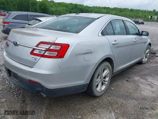 2014 Ford Taurus SEL with VIN 1FAHP2H8XEG161271, listed as a IAAI auction lot 42105228 with 140,256 mi miles. Bid and sale history available at carsss.com. Image 4.
