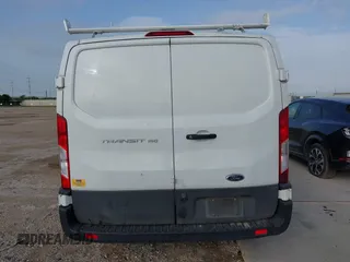 2020 Ford Transit Cargo z VIN 1FTYE1Y82LKB45974, wystawiony jako IAAI lot #42614744 z przebiegiem 200 241 mil mil oraz . Historia ofert i sprzedaży dostępna na DreamBid. Obrazek 16.
