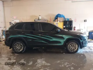 2015 Jeep Cherokee Sport with VIN 1C4PJMAB6FW773953, listed as a IAAI auction lot 41565879 with 242,580 mi miles. Bid and sale history available at carsss.com. Image 13.
