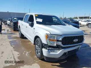 2021 Ford F-150 XL with VIN 1FTEW1C52MKD15474, listed as a IAAI auction lot 41774168 with 100,761 mi miles. Bid and sale history available at carsss.com. Image 1.