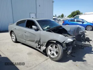 2019 Dodge Charger SXT with VIN 2C3CDXBGXKH659890, listed as a Copart auction lot 58011735 with 112,293 mi miles and Salvage title. Bid and sale history available at DreamBid. Image 4.
