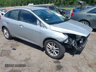 2016 Ford Focus SE z VIN 1FADP3F28GL365676, wystawiony jako IAAI lot #42221665 z przebiegiem 54 899 mil mil oraz . Historia ofert i sprzedaży dostępna na DreamBid. Obrazek 1.