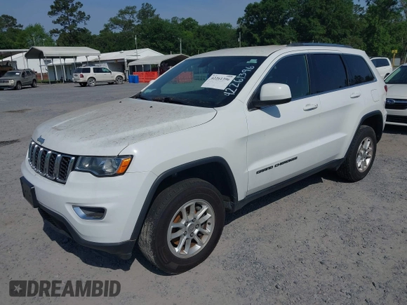2020 Jeep Grand Cherokee Laredo E with VIN 1C4RJFAG1LC389026, listed as a IAAI auction lot 42261396 with 100,409 mi miles and . Bid and sale history available at DreamBid. Image 2.