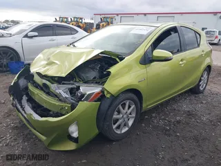 2015 Toyota Prius c One with VIN JTDKDTB36F1096872, listed as a IAAI auction lot 41202434 with 130,386 mi miles. Bid and sale history available at carsss.com. Image 2.