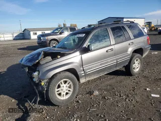 2003 Jeep Grand Cherokee Limited z VIN 1J8GW58N73C502929, wystawiony jako Copart lot #79472734 z przebiegiem 231 176 mil mil oraz Szkoda całkowita • Salvage title. Historia ofert i sprzedaży dostępna na DreamBid. Obrazek 1.