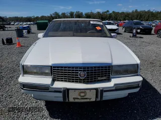 1990 Cadillac Eldorado z VIN 1G6EL1334LU616468, wystawiony jako Copart lot #76398934 z przebiegiem Nie podano mil oraz Szkody całkowita. Historia ofert i sprzedaży dostępna na DreamBid. Obrazek 5.