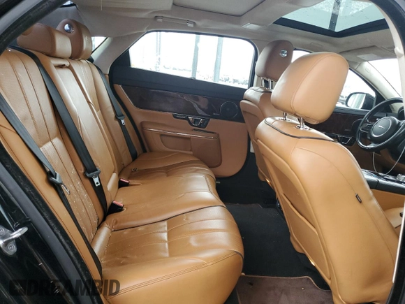 2014 Jaguar XJ Portfolio with VIN SAJWJ2GD5E8V69982, listed as a Copart auction lot 58933515 with 92,847 mi miles and Salvage title. Bid and sale history available at DreamBid. Image 10.