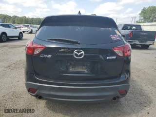 2014 Mazda CX-5 Touring with VIN JM3KE2CY7E0427312, listed as a Copart auction lot 52869335 with 192,903 mi miles and Salvage Title. Bid and sale history available at carsss.com. Image 6.