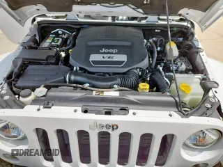 2014 Jeep Wrangler Unlimited Sahara with VIN 1C4BJWEG5EL309502, listed as a Copart auction lot 61804885 with 60,683 mi miles and Salvage title. Bid and sale history available at DreamBid. Image 11.
