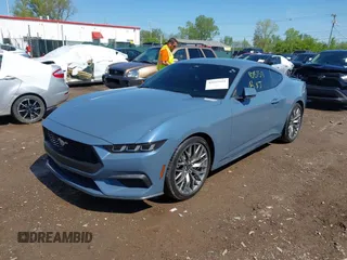 2024 Ford Mustang EcoBoost with VIN 1FA6P8TH8R5140468, listed as a IAAI auction lot 42157511 with 9,559 mi miles and . Bid and sale history available at DreamBid. Image 2.