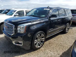 2020 GMC Yukon Denali with VIN 1GKS1CKJXLR181612, listed as a Copart auction lot 74451364 with 52,761 mi miles and Salvage Title. Bid and sale history available at carsss.com. Image 1.