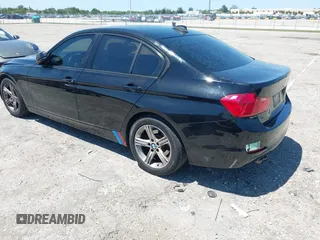 2015 BMW 3 Series 328i with VIN WBA3C1C58FK123489, listed as a IAAI auction lot 42026400 with 127,880 mi miles and . Bid and sale history available at carsss.com. Image 3.