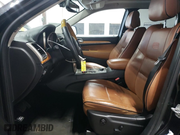 2013 Jeep Grand Cherokee Overland with VIN 1C4RJFCG7DC646348, listed as a Copart auction lot 49526415 with 137,889 mi miles and Clean Title. Bid and sale history available at carsss.com. Image 7.