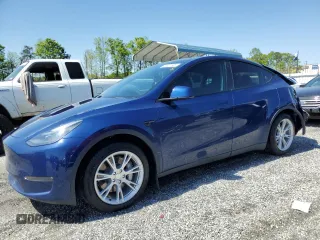 2023 Tesla Model Y Long Range z VIN 7SAYGDEE1PA027276, wystawiony jako Copart lot #52437965 z przebiegiem 41 656 mil mil oraz Szkody całkowita. Historia ofert i sprzedaży dostępna na DreamBid. Obrazek 1.