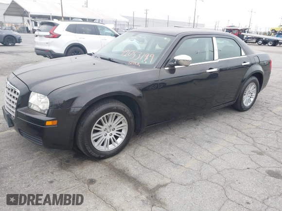 2009 Chrysler 300 LX with VIN 2C3KA43D19H506753, listed as a IAAI auction lot 42053199 with 106,092 mi miles. Bid and sale history available at carsss.com. Image 2.