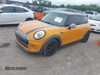 2015 MINI Hardtop with VIN WMWXM5C58FT942888, listed as a IAAI auction lot 42226391 with 61,935 mi miles and . Bid and sale history available at DreamBid. Image 2.
