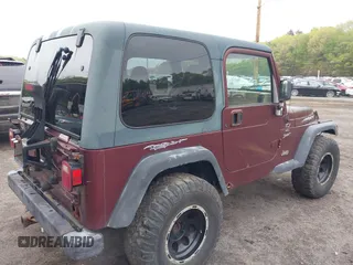 2001 Jeep Wrangler Sport with VIN 1J4FA49S31P301237, listed as a IAAI auction lot 42191884 with 154,627 mi miles and . Bid and sale history available at carsss.com. Image 4.