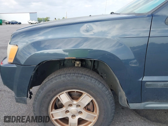 2007 Jeep Grand Cherokee Laredo with VIN 1J8GS48K17C684497, listed as a IAAI auction lot 42136314 with 155,024 mi miles. Bid and sale history available at carsss.com. Image 13.