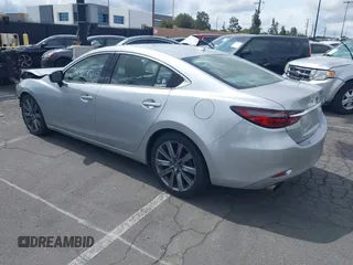 2018 Mazda 6 Grand Touring with VIN JM1GL1TY0J1306768, listed as a IAAI auction lot 41744640 with 81,798 mi miles and . Bid and sale history available at DreamBid. Image 3.