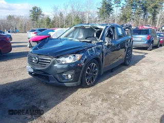 2016 Mazda CX-5 Grand Touring with VIN JM3KE4DY4G0909782, listed as a IAAI auction lot 41006111 with 30,135 mi miles. Bid and sale history available at carsss.com. Image 16.