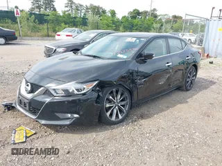2016 Nissan Maxima Platinum z VIN 1N4AA6AP8GC901079, wystawiony jako IAAI lot #42423396 z przebiegiem 100 750 mil mil oraz . Historia ofert i sprzedaży dostępna na DreamBid. Obrazek 2.