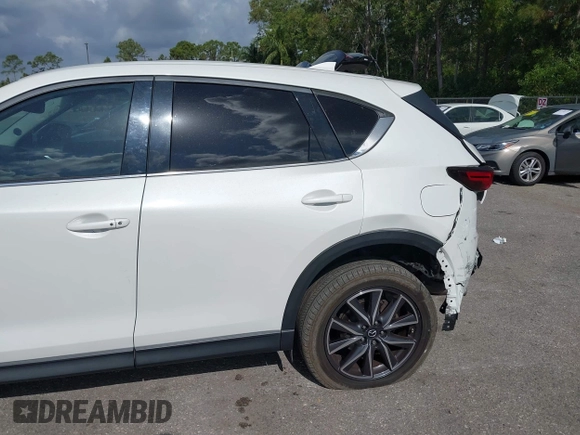 2018 Mazda CX-5 Grand Touring with VIN JM3KFBDM6J0451605, listed as a IAAI auction lot 42099182 with 81,703 mi miles and . Bid and sale history available at DreamBid. Image 6.
