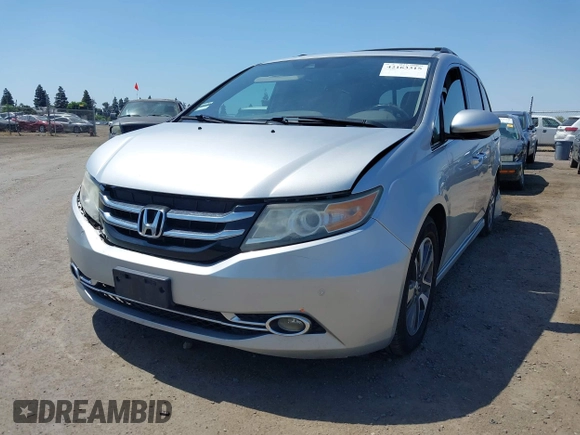 2014 Honda Odyssey Touring with VIN 5FNRL5H91EB068427, listed as a IAAI auction lot 42163315 with 184,134 mi miles and . Bid and sale history available at DreamBid. Image 2.
