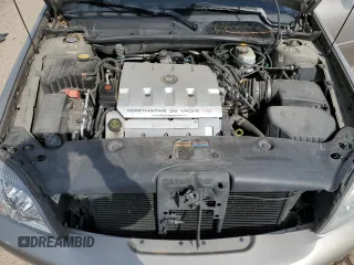2001 Cadillac DeVille z VIN 1G6KD54YX1U242656, wystawiony jako Copart lot #54566105 z przebiegiem 200 016 mil mil oraz Szkoda całkowita • Salvage title. Historia ofert i sprzedaży dostępna na DreamBid. Obrazek 11.