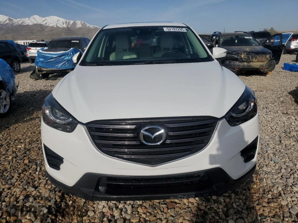 2016 Mazda CX-5 Grand Touring with VIN JM3KE4DY3G0688286, listed as a Copart auction lot 52182205 with 194,352 mi miles and Salvage Title. Bid and sale history available at DreamBid. Image 5.