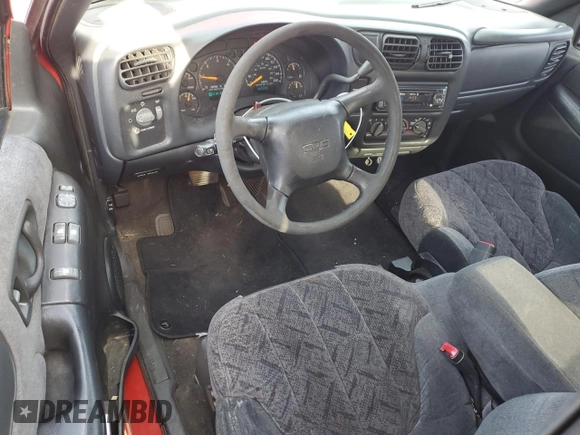 2000 GMC Sonoma SLS z VIN 1GTCS19W1Y8114591, wystawiony jako Copart lot #70182694 z przebiegiem 182 093 mil mil oraz Szkody całkowita. Historia ofert i sprzedaży dostępna na DreamBid. Obrazek 8.