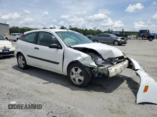 2003 Ford Focus ZX3 with VIN 3FAFP31383R117755, listed as a Copart auction lot 60668725 with 135,856 mi miles and Salvage title. Bid and sale history available at DreamBid. Image 4.