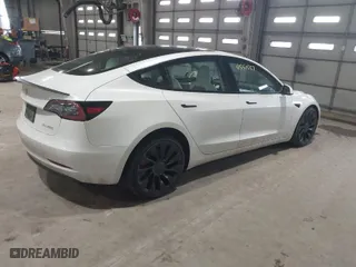 2023 Tesla Model 3 Performance with VIN 5YJ3E1EC3PF404882, listed as a IAAI auction lot 41551557 with 36,698 mi miles. Bid and sale history available at carsss.com. Image 4.