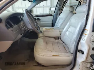 1999 Lincoln Town Car Executive with VIN 1LNHM81W2XY658371, listed as a Copart auction lot 60249045 with 191,266 mi miles and Salvage title. Bid and sale history available at DreamBid. Image 7.