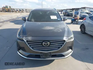 2016 Mazda CX-9 Grand Touring with VIN JM3TCADY8G0114940, listed as a IAAI auction lot 40701187 with 112,311 mi miles and . Bid and sale history available at DreamBid. Image 12.