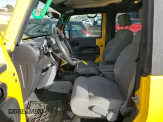 2009 Jeep Wrangler Rubicon with VIN 1J4GA64109L707008, listed as a Copart auction lot 87492674 with 157,104 mi miles and Salvage Title. Bid and sale history available at DreamBid. Image 7.