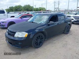 2014 Dodge Avenger SE with VIN 1C3CDZAG3EN104594, listed as a IAAI auction lot 42561392 with 129,208 mi miles and . Bid and sale history available at DreamBid. Image 2.