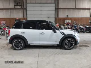2016 MINI Countryman S with VIN WMWZC5C57GWU20085, listed as a IAAI auction lot 42403406 with 90,592 mi miles and . Bid and sale history available at DreamBid. Image 14.