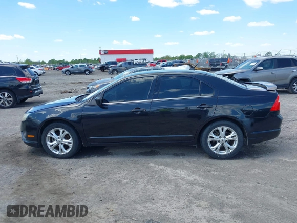 2012 Ford Fusion SE z VIN 3FAHP0HG8CR339020, wystawiony jako IAAI lot #41962046 z przebiegiem 136 072 mil mil oraz . Historia ofert i sprzedaży dostępna na DreamBid. Obrazek 14.