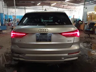2019 Audi Q3 Premium with VIN WA1AECF33K1077204, listed as a IAAI auction lot 41538374 with 101,264 mi miles and . Bid and sale history available at DreamBid. Image 16.