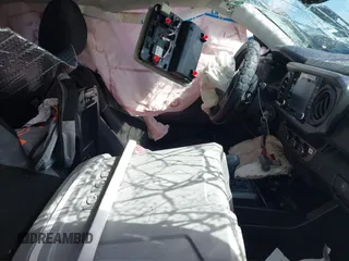 2021 Toyota Tacoma SR with VIN 3TYRX5GN6MT031018, listed as a IAAI auction lot 42276988 with Not provided miles and . Bid and sale history available at DreamBid. Image 5.