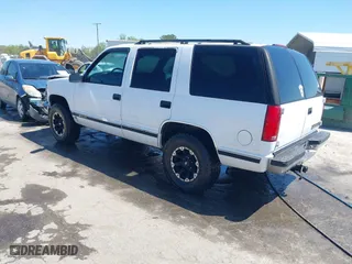 1997 Chevrolet Tahoe with VIN 1GNEK13R8VJ338626, listed as a IAAI auction lot 41976126 with 163,263 mi miles. Bid and sale history available at carsss.com. Image 3.