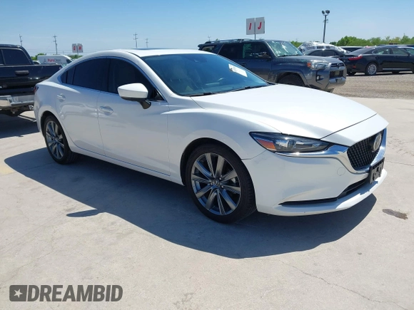2021 Mazda 6 Touring with VIN JM1GL1VM4M1618686, listed as a IAAI auction lot 42079730 with 55,539 mi miles and . Bid and sale history available at DreamBid. Image 1.