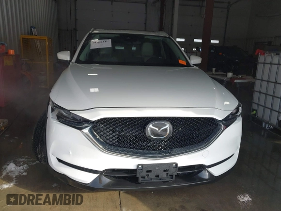 2021 Mazda CX-5 Grand Touring with VIN JM3KFADM3M0312143, listed as a IAAI auction lot 41606582 with 46,515 mi miles. Bid and sale history available at carsss.com. Image 12.