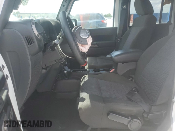 2012 Jeep Wrangler Unlimited Sport with VIN 1C4BJWDG6CL240673, listed as a Copart auction lot 60669625 with Not provided miles and Salvage title. Bid and sale history available at DreamBid. Image 7.
