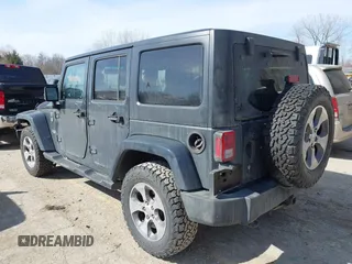 2016 Jeep Wrangler Unlimited 75th Anniversary with VIN 1C4BJWEG9GL250408, listed as a IAAI auction lot 41793706 with 102,436 mi miles. Bid and sale history available at carsss.com. Image 3.