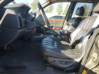 1999 Jeep Grand Cherokee Limited with VIN 1J4G268SXXC759016, listed as a Copart auction lot 80307534 with 215,870 mi miles and Salvage title. Bid and sale history available at DreamBid. Image 7.